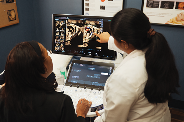 Fetal heart providers viewing fetal echo on monitor